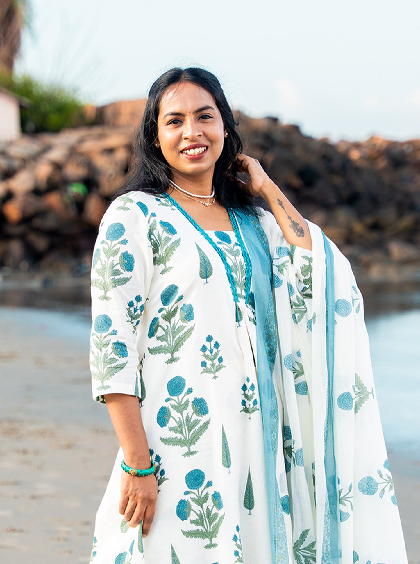Close-up of cyan floral motif pattern on cotton fabric — Ariyaa