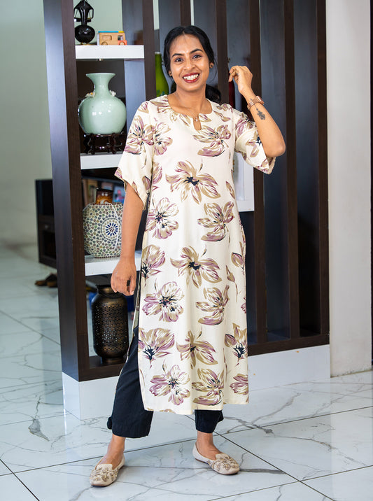 Cream kurti with kimono sleeves styled with black pants and juttis - Ariyaa