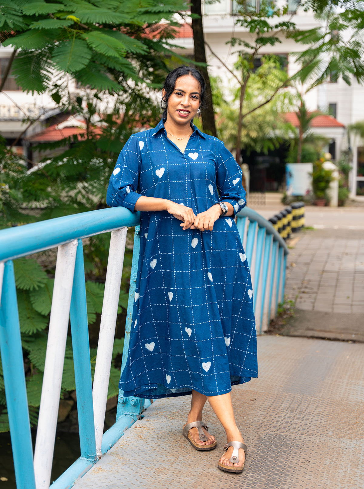 Woman wearing indigo hand block print cotton shirt dress with white heart motifs, front view - Ariyaa