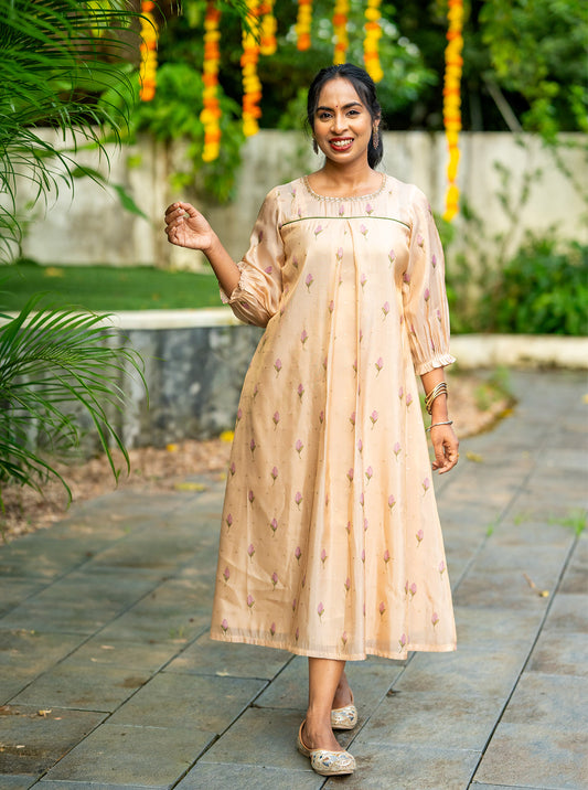 Mythili soft peach digital print silk A-line kurti front view with lace round neck - Ariyaa