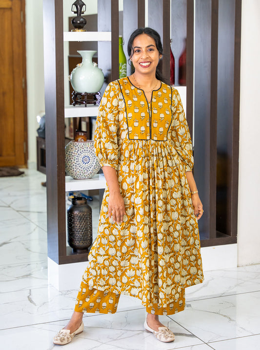 Front view of Dusky Lotus tanned yellow floral cotton A-line co-ord set with U-with-V neck - Ariyaa