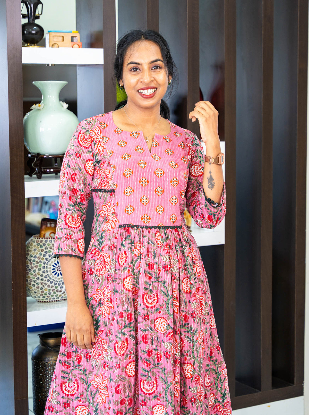 Pink floral kurti with contrast buti yoke and green lace detailing, front close-up - Ariyaa