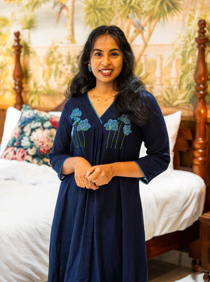 Navy blue embroidered slub cotton A-line kurti with V neck, front view - Ariyaa