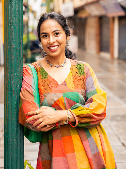 Multicolour Madras checks kurti with smocked V-neck yoke detail
