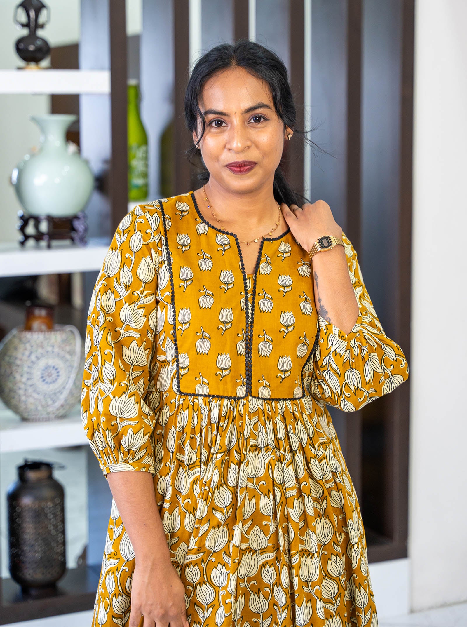 Close-up of tanned yellow floral motif cotton fabric texture - Ariyaa