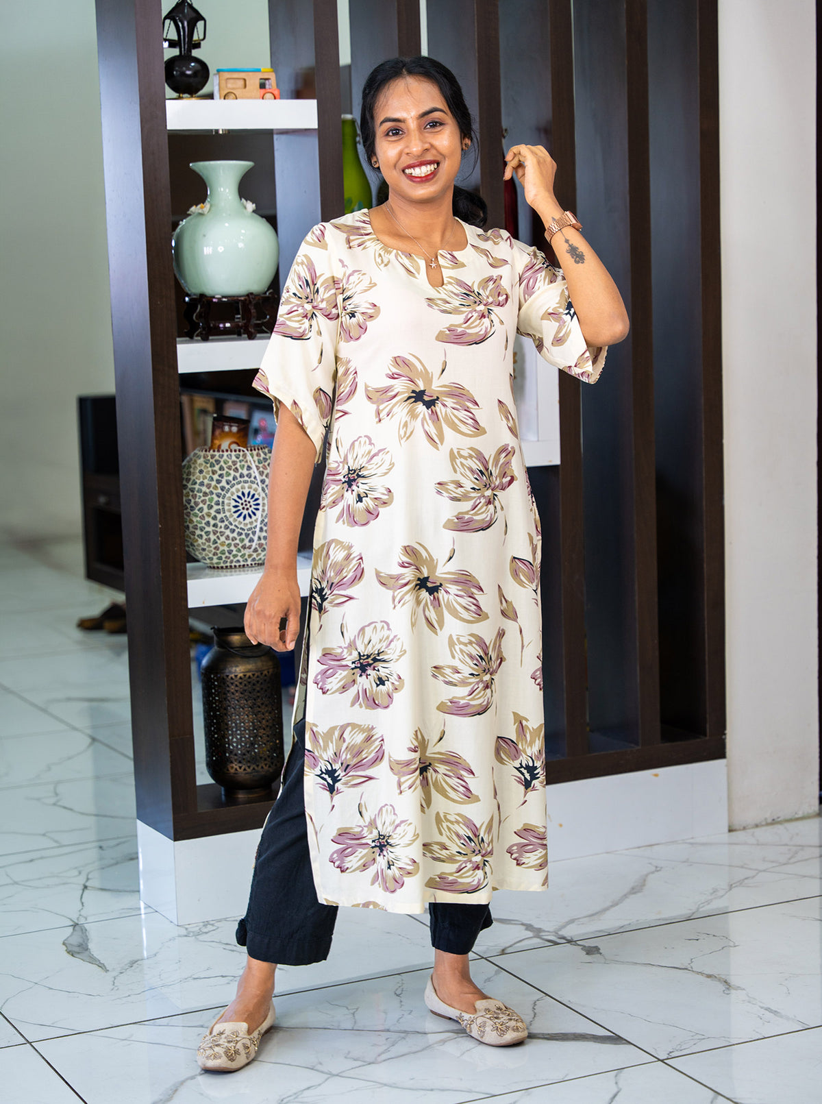 Cream kurti with kimono sleeves styled with black pants and juttis - Ariyaa
