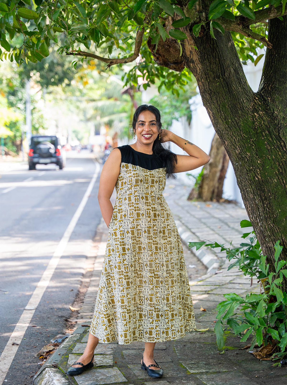 Sandal A-line kurti with side pockets and easy flare, styled with black flats - Ariyaa