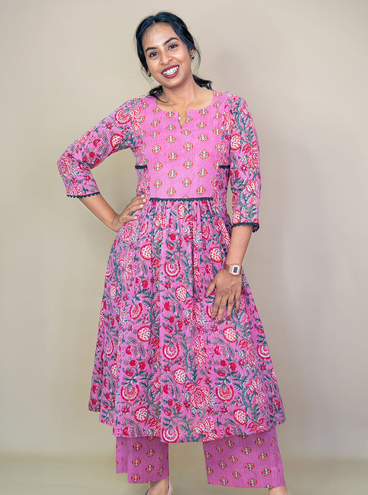 Pink floral co-ord set showing gathered flare and notch V neckline, front view - Ariyaa