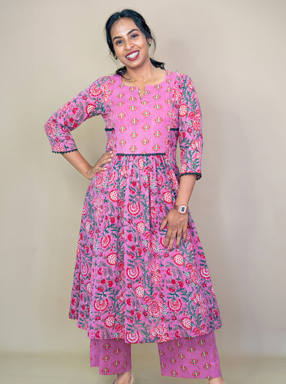 Pink floral co-ord set showing gathered flare and notch V neckline, front view - Ariyaa