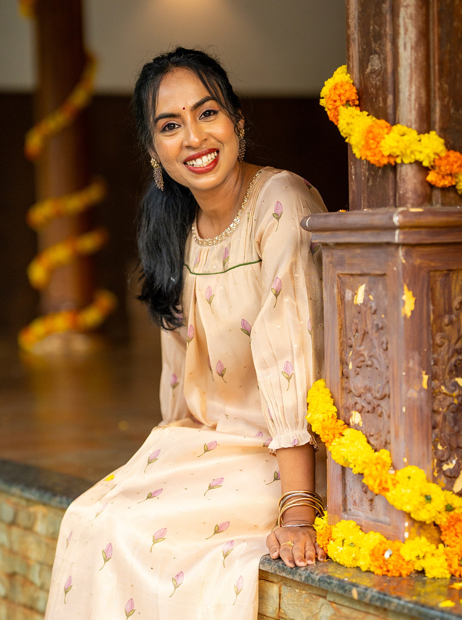 Side profile of Mythili peach silk kurti showing A-line silhouette and drape - Ariyaa