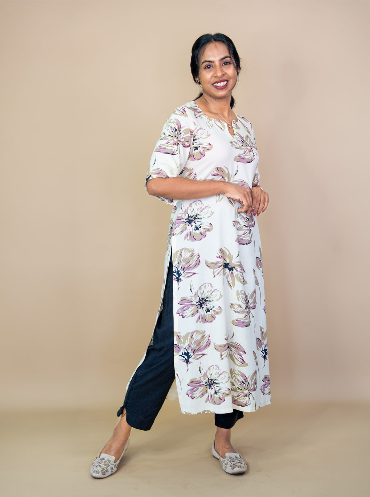 Side view of cream floral kurti showing high side slit and easy drape - Ariyaa