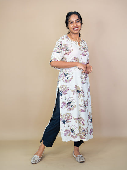 Side view of cream floral kurti showing high side slit and easy drape - Ariyaa