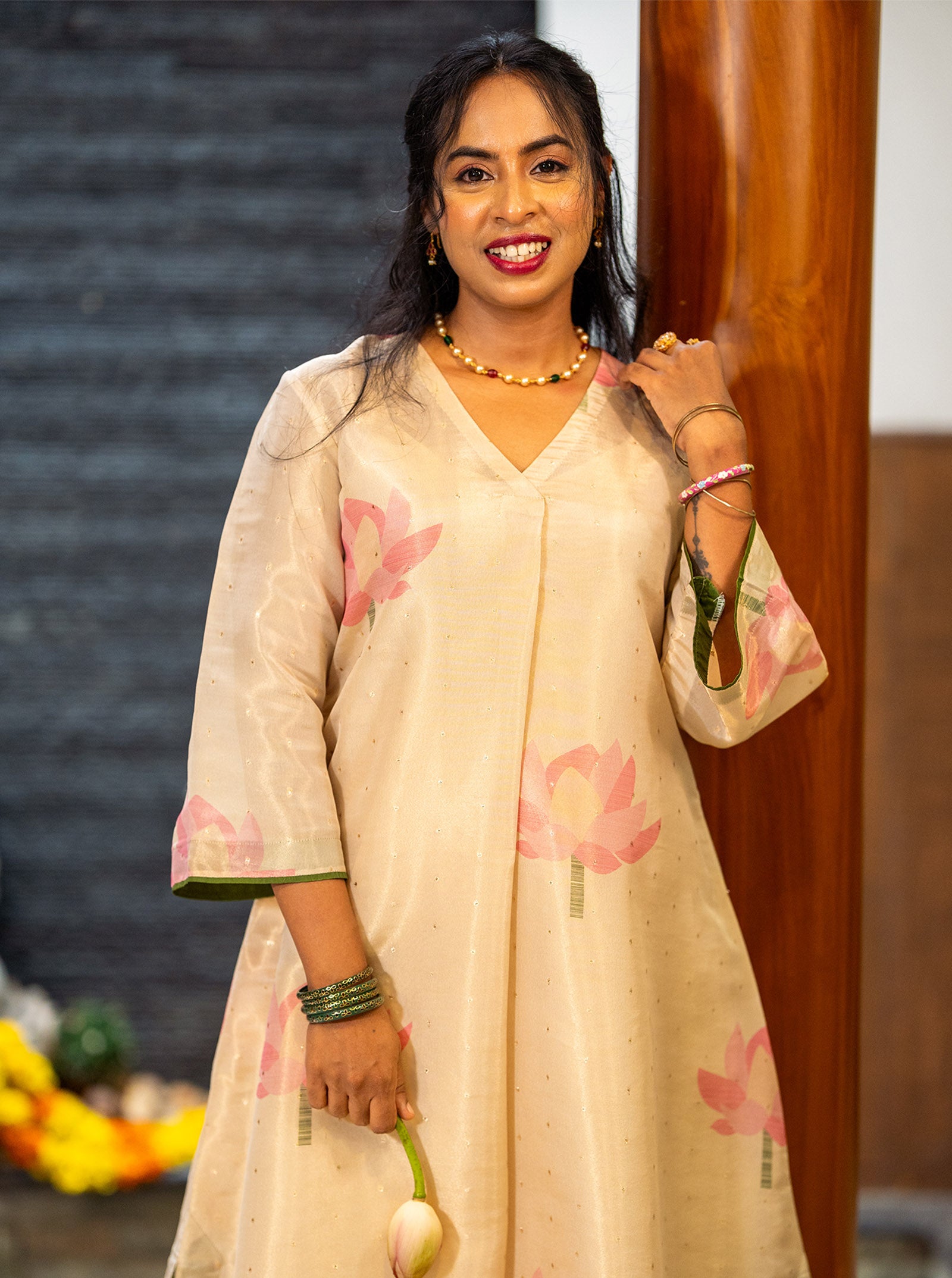 Mathangi kurti styled with pearl necklace and green bangles for a Kerala Onam look - Ariyaa