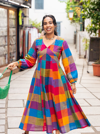Woman wearing Madras checks A-line checks kurti with V neck and full sleeves