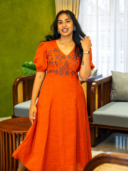47 inch orange A-line dress showing panel seams and skirt flare - Ariyaa