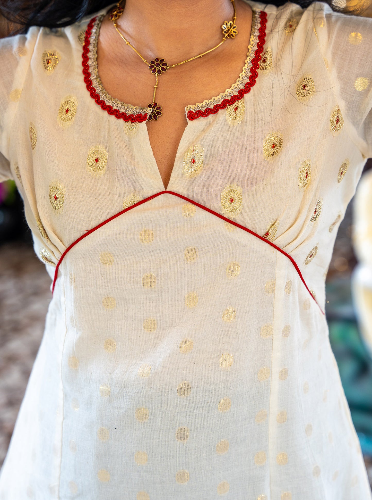 Close-up of golden butti lurex cotton fabric weave - Ariyaa