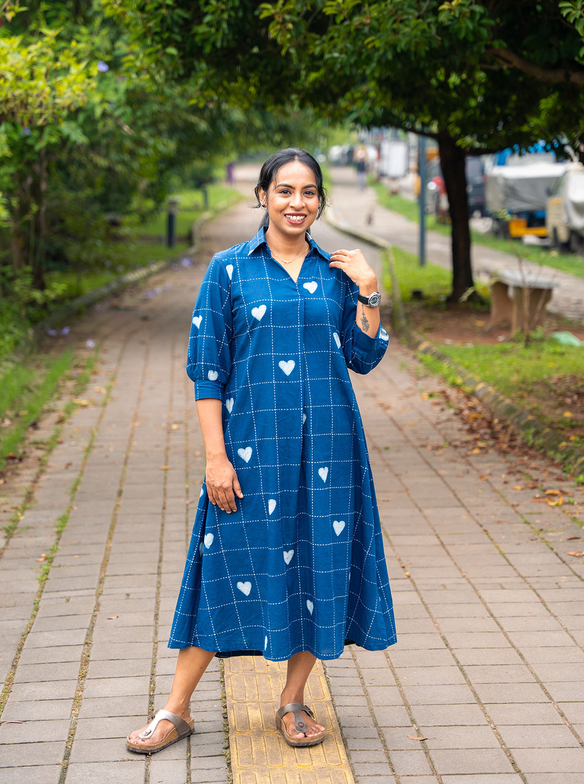 Back view of indigo cotton shirt dress with yoke gathers and relaxed flare - Ariyaa