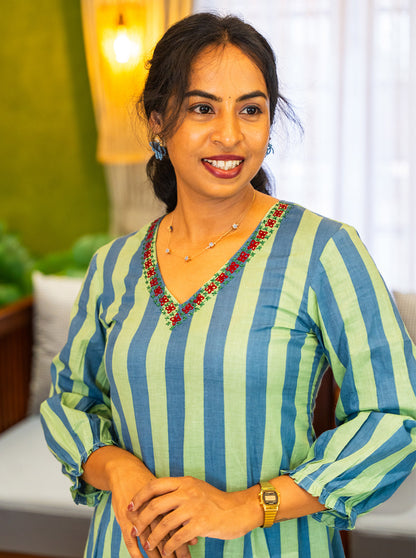 Close-up of embroidered V neckline on blue and green striped cotton - Ariyaa