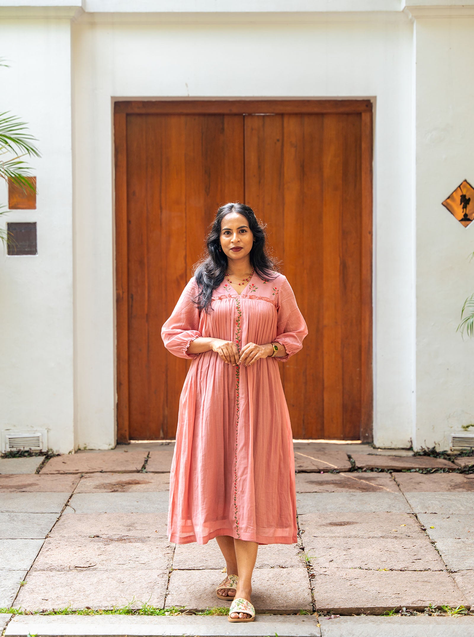 Model wearing pastel pink embroidered kurti full length — Ariyaa
