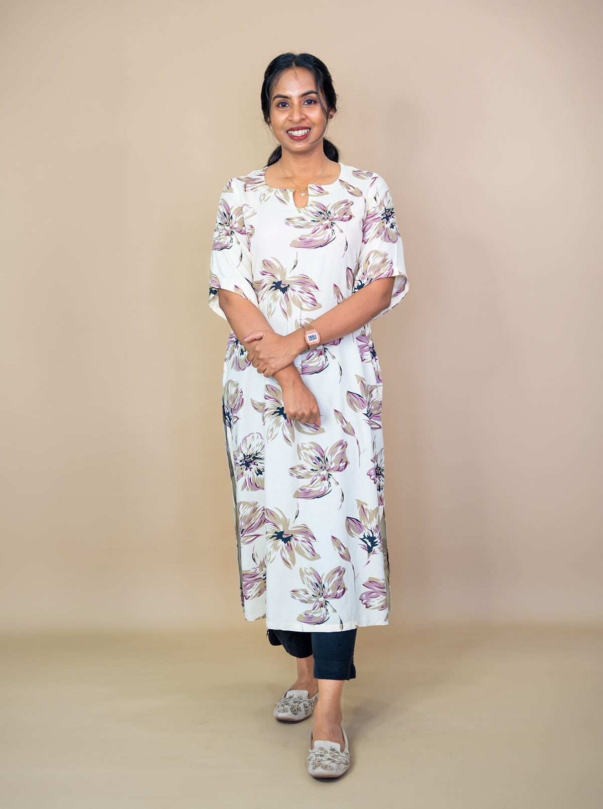 Full length cream rayon kurti styled for daily wear with flats - Ariyaa