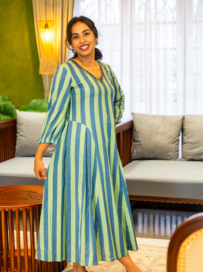 Blue and green striped frock dress showing A-line flare and panel seams - Ariyaa