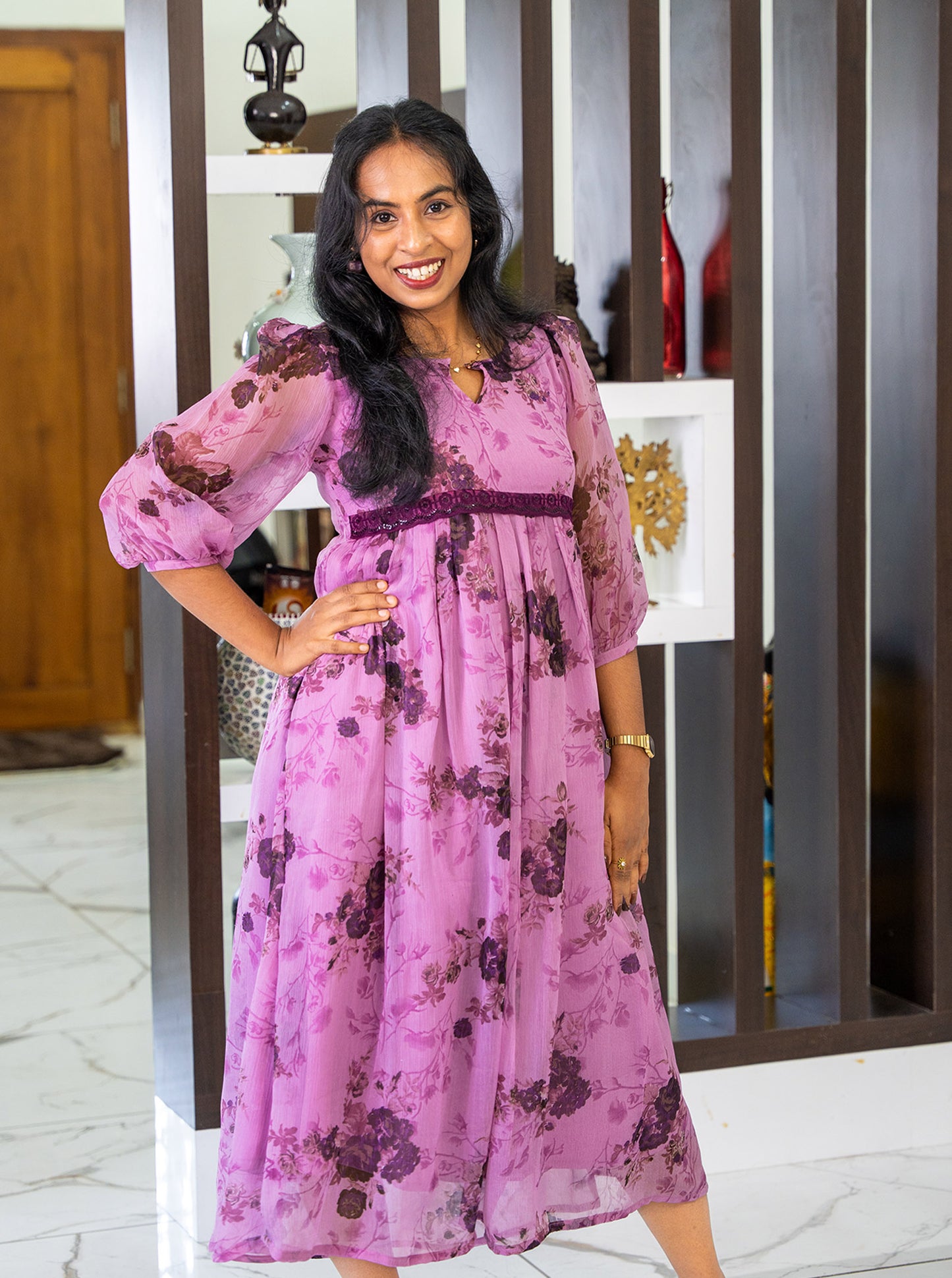 Side profile of purple floral kurti showing relaxed A-line drape - Ariyaa