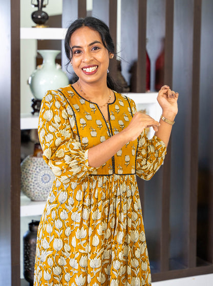 Side profile of tanned yellow co-ord set showing A-line silhouette - Ariyaa