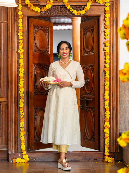 Cream panel cut kurti in movement showing lined comfortable fit - Ariyaa