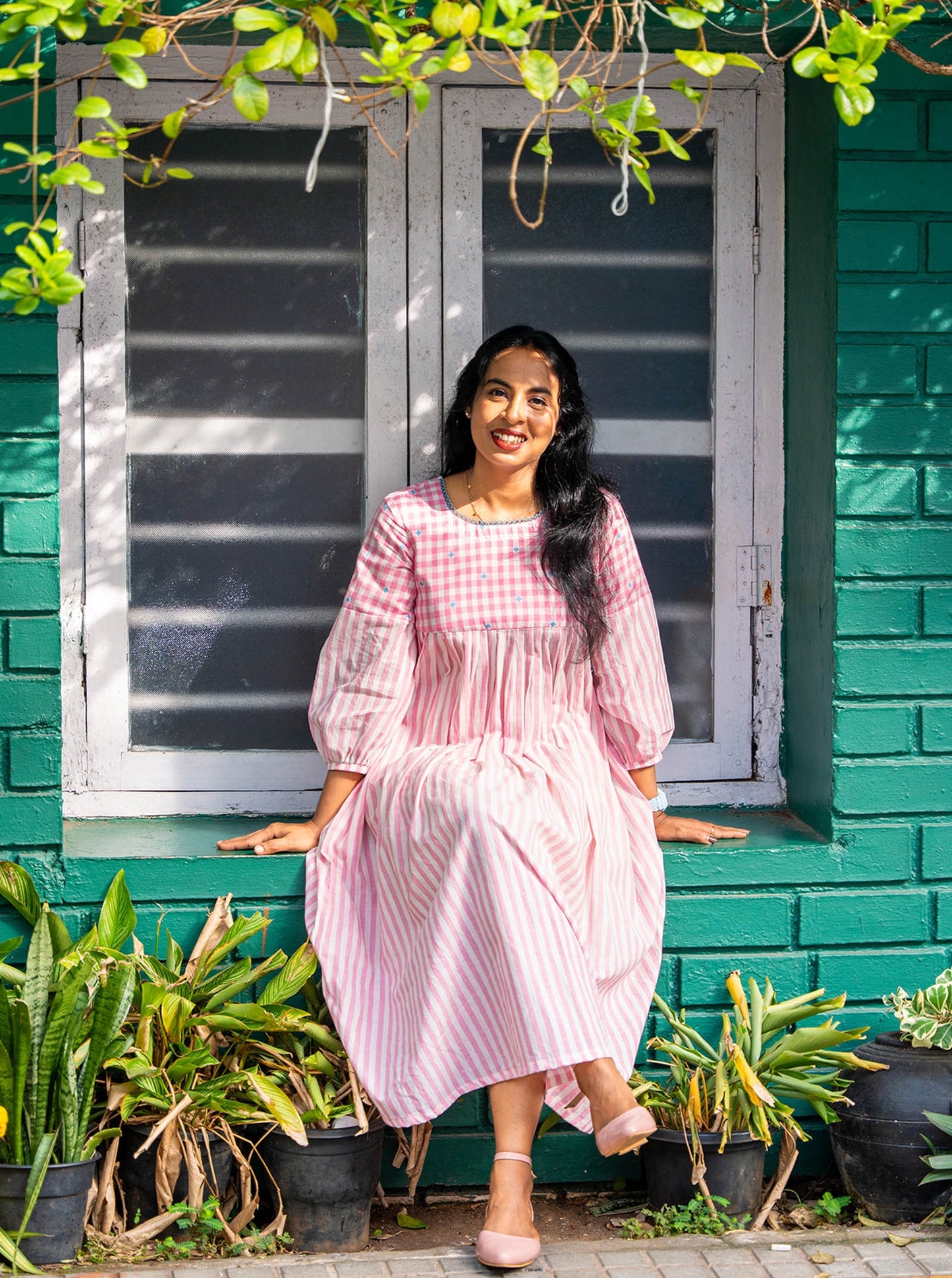 Woman styled in pink and white handloom cotton office kurti - Ariyaa