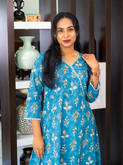 Side profile of blue cotton kurti showing side slit and gentle flare - Ariyaa