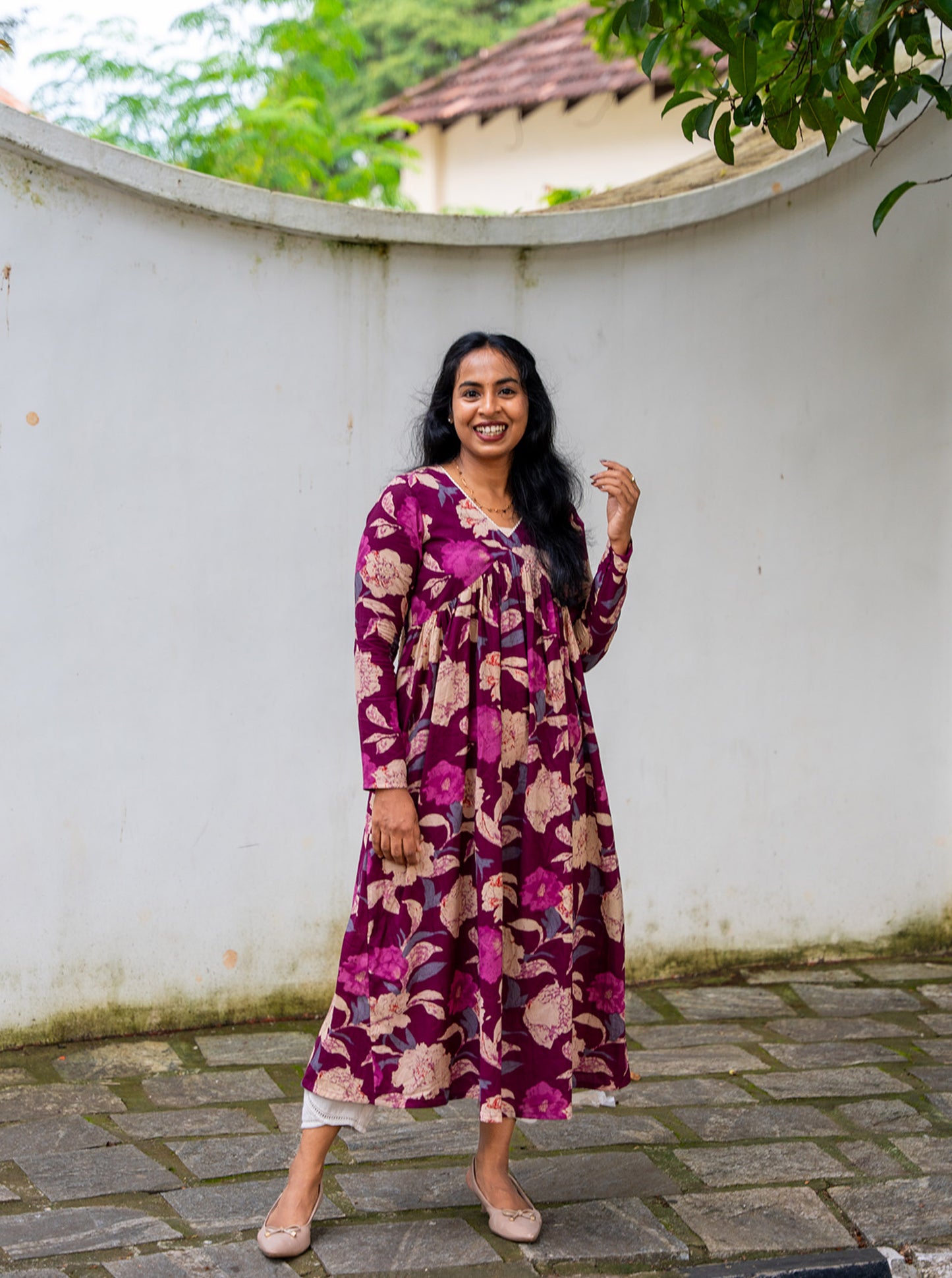 Purple floral cotton kurti styled with jeans for casual wear - Ariyaa