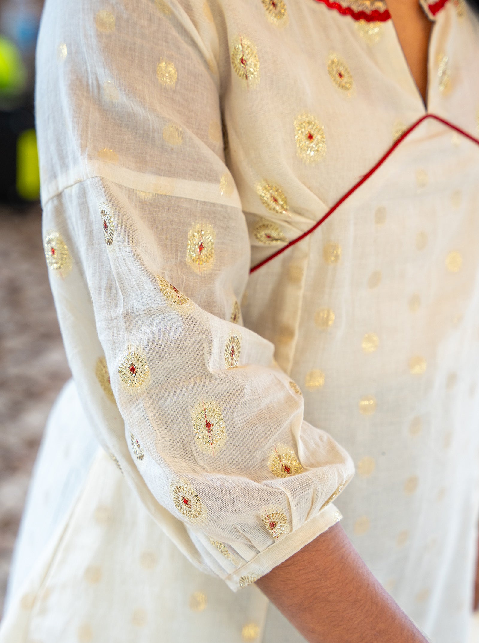 Detail shot of red butti yoke and lace neckline on cream kurti - Ariyaa
